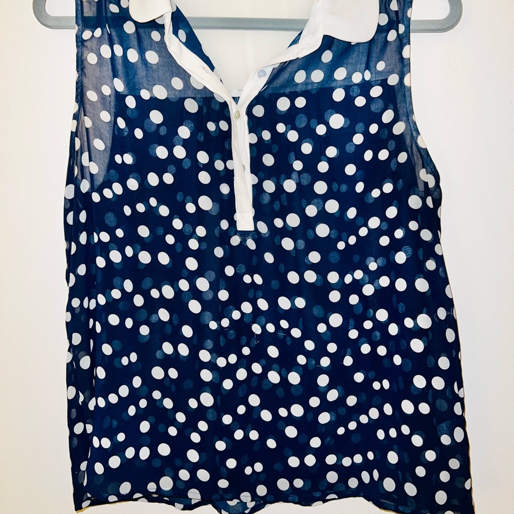 Navy sleeveless blouse with polka dots